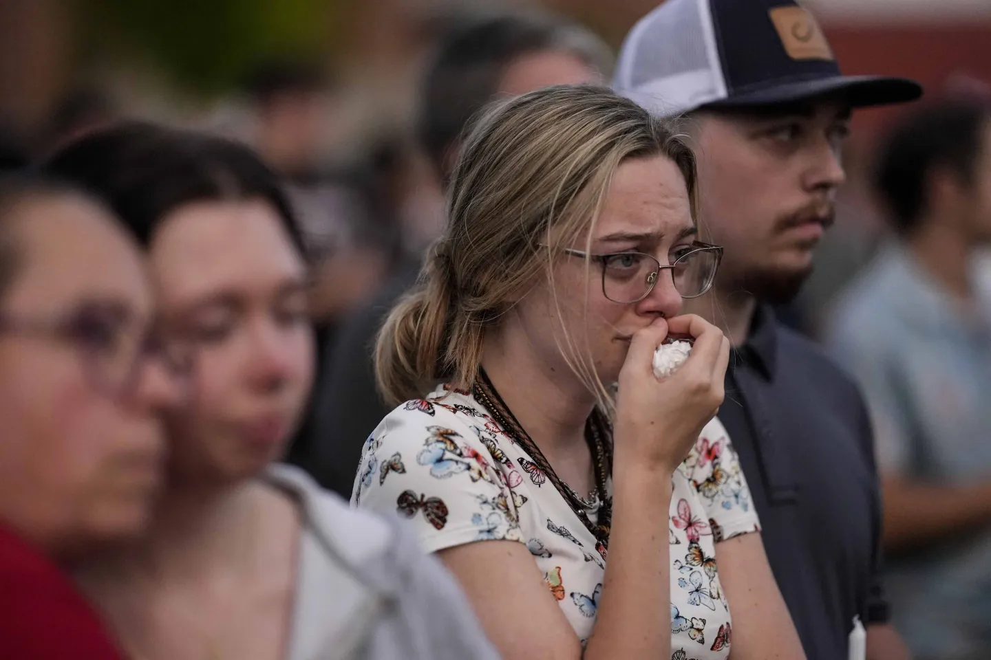 Woman crying during a candlelight vigil for students and teachers of Apalachee High School