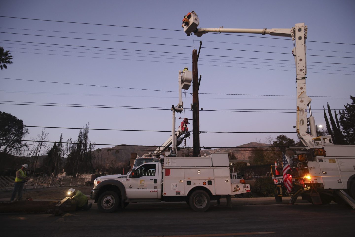 An Edison truck parked in front of a utility pole in California