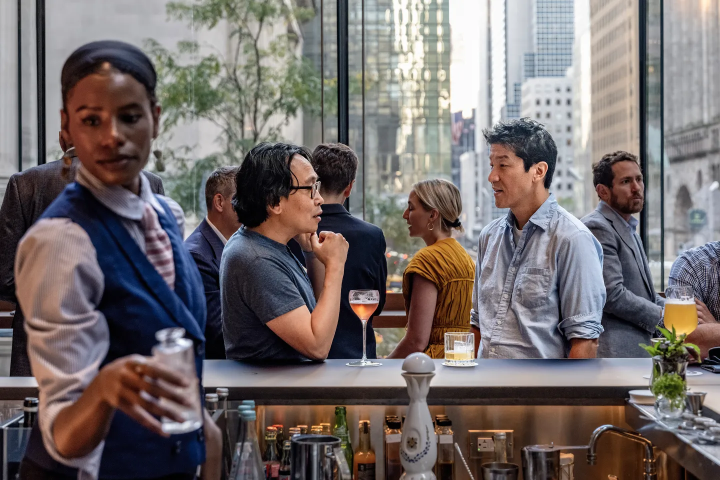 A bartender seves drinks to customers