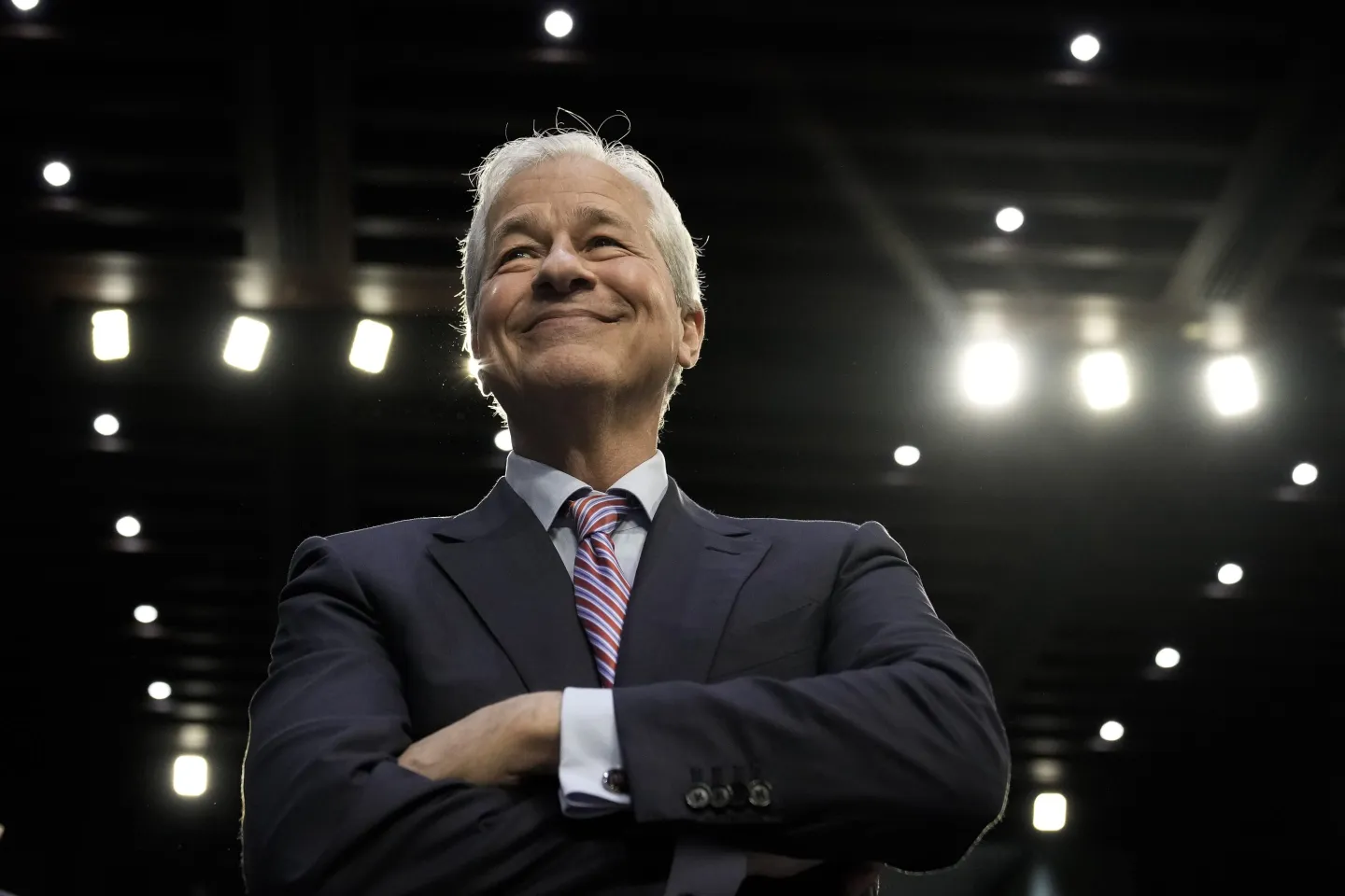 Jamie Dimon crossing his arms and smiling