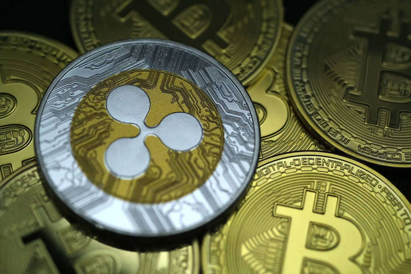 KATWIJK, NETHERLANDS - JANUARY 3: In this photo illustration, visual representations of digital cryptocurrency Ripple (XRP) and Bitcoin (BTC) are arranged on January 3, 2021 in Katwijk, Netherlands.  (Photo by Yuriko Nakao/Getty Images)