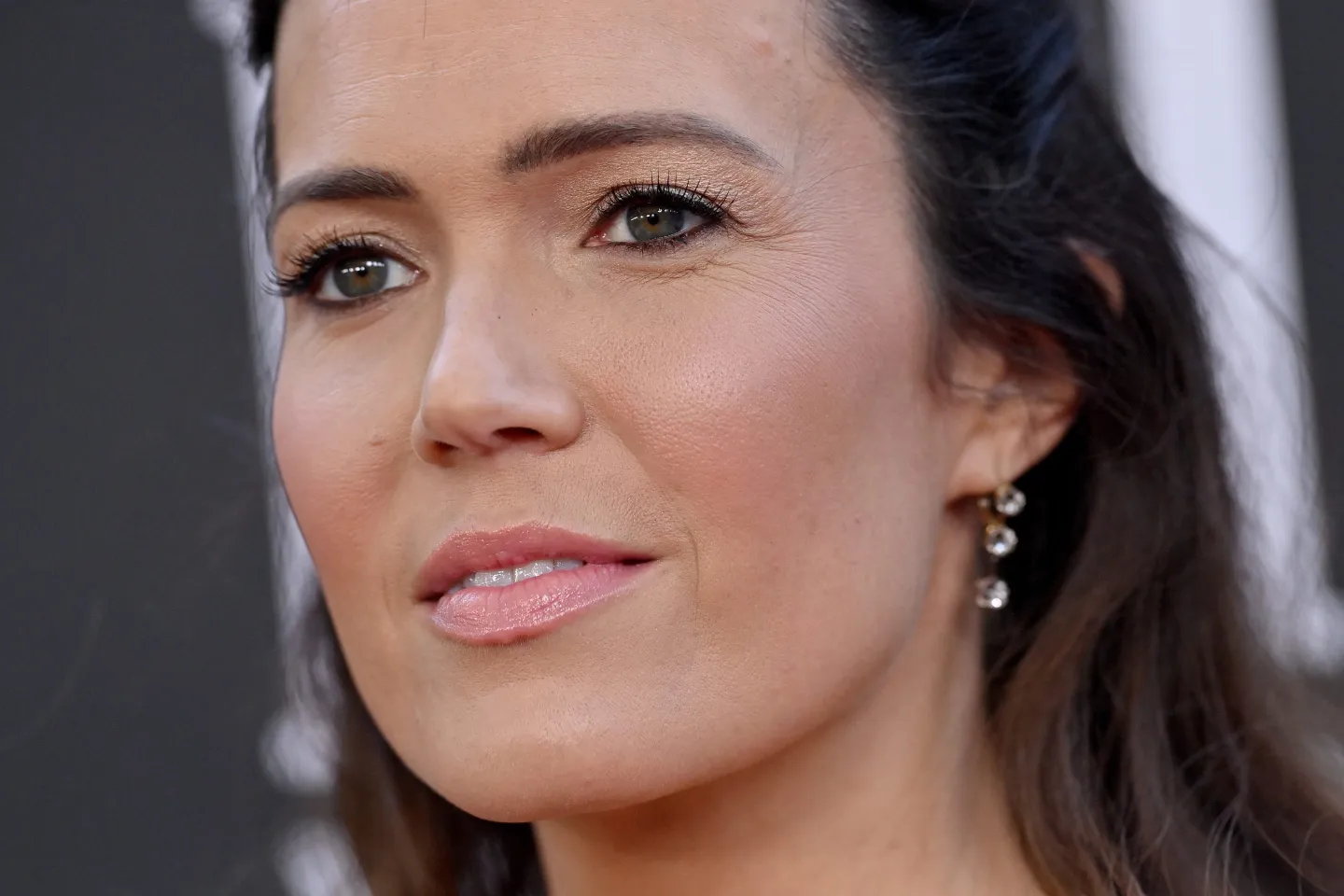 A close-up of Mandy Moore with a serious facial expression