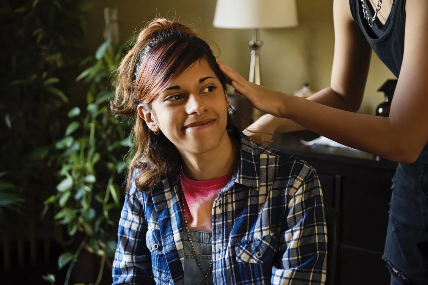 Transgender teen having hair done