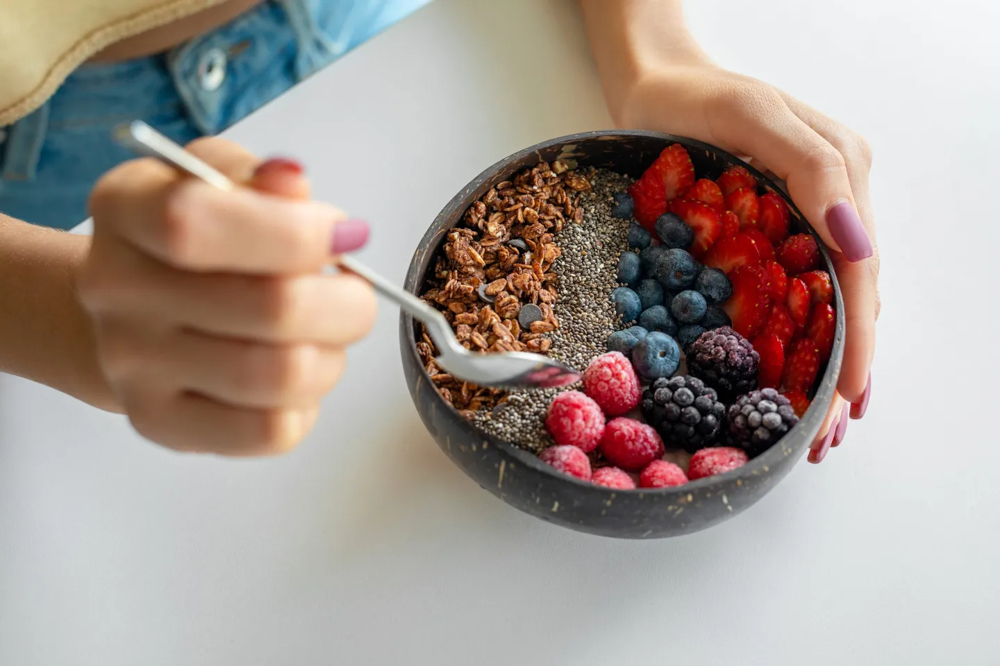 Smoothie bowl with fresh berries and granola