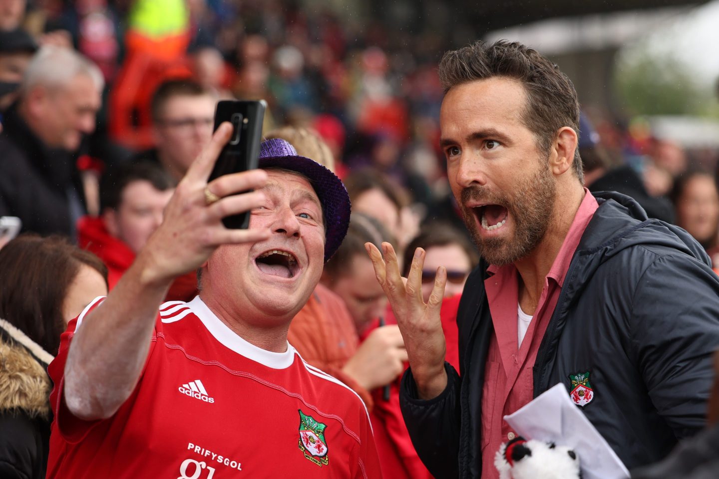 WREXHAM, WALES - AUGUST 5: Ryan Reynolds the co-owner of Wrexham greets the fans prior to Wrexham&#039;s first game back in the football league prior to the Sky Bet League Two match between Wrexham and Milton Keynes Dons at Racecourse Ground on August 5, 2023 in Wrexham, Wales. (Photo by Matthew Ashton - AMA/Getty Images)