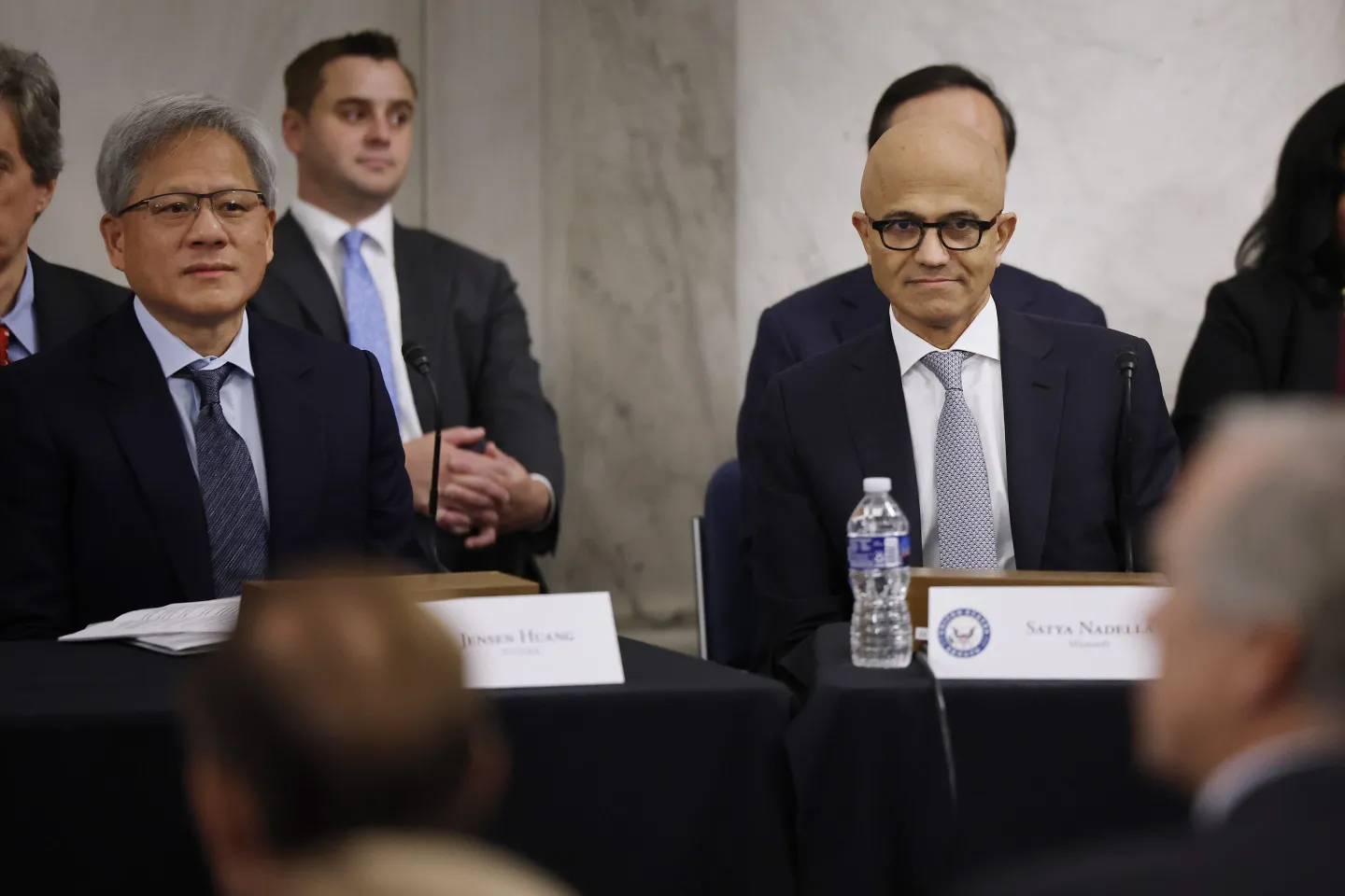 Nvidia CEO Jensen Huang and Microsoft CEO Satya Nadella sitting next to each other during a meeting