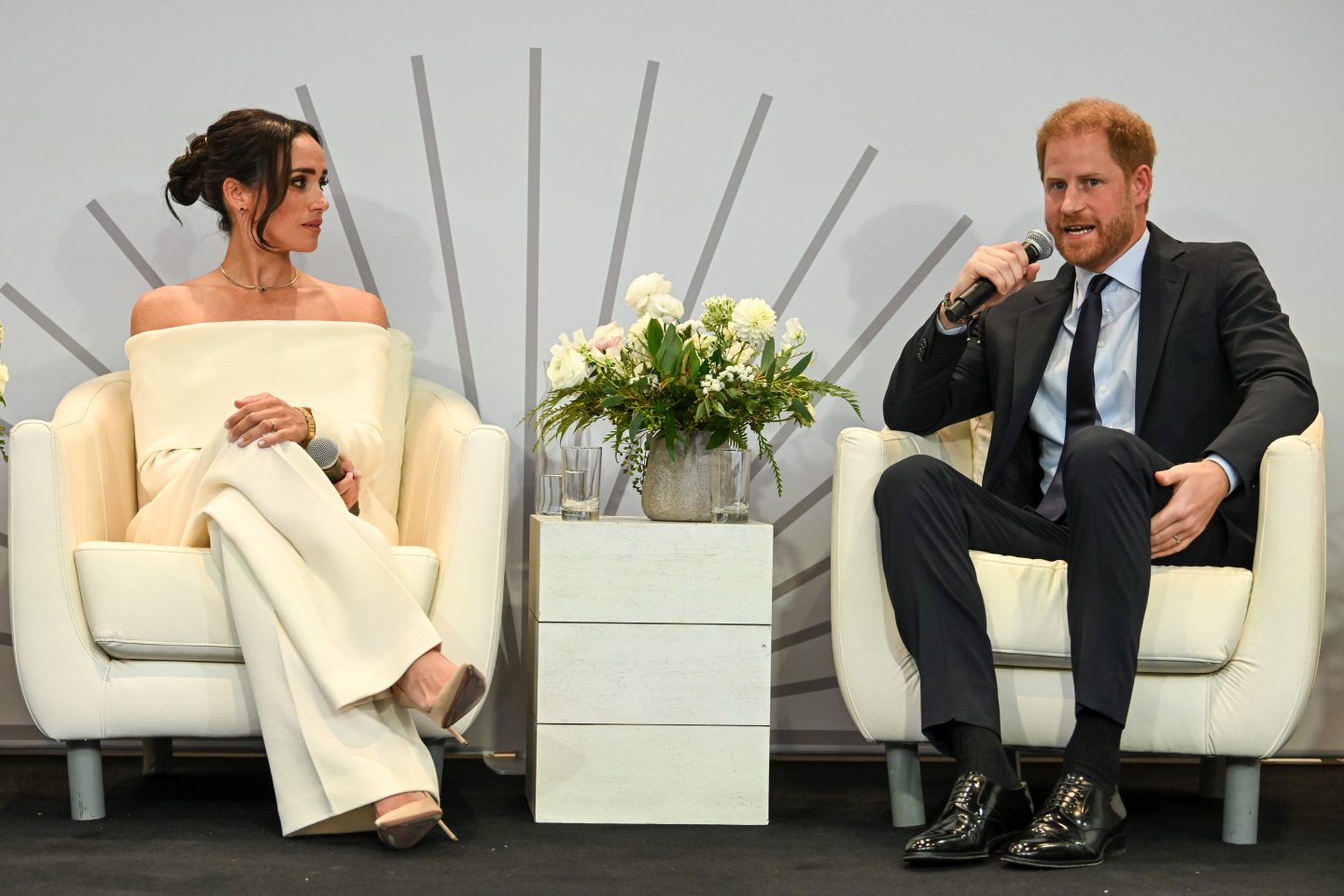 Prince Harry and Meghan Markle sitting giving an interview