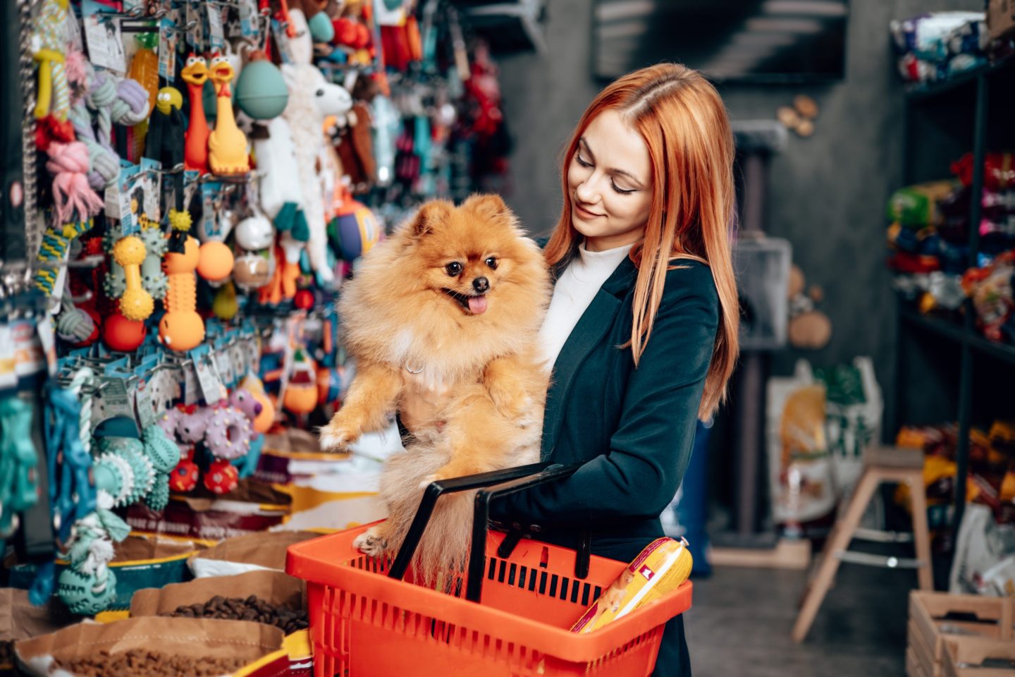 Woman with dog at dog store.