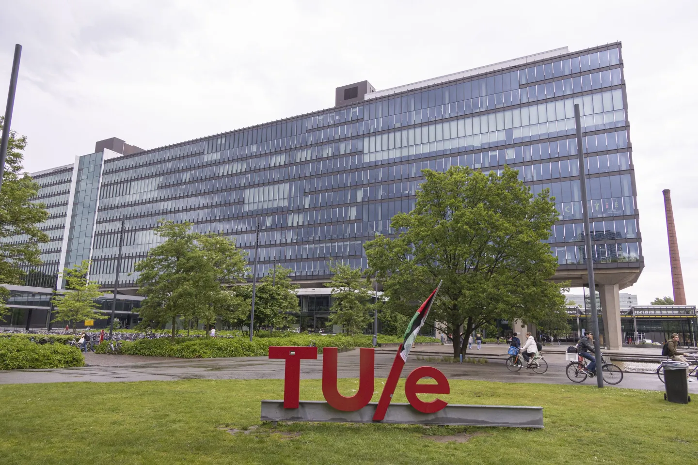 Exterior view of the buildings of TUe with the logo of the university and Palestinian flag. Dutch students of Eindhoven University of Technology TU/e along with staff and international students and supporters protest for Palestine and set up an encampment on the lawn of the university campus between the buildings on May 13, 2024.