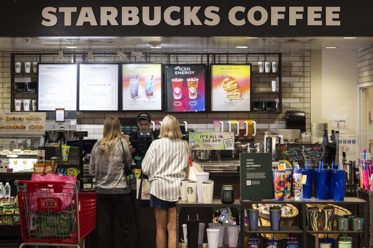 Customers order at a Starbucks in Manhattan Beach, California, on July 19, 2024. Starbucks is among the businesses impacted as Airlines, banks, TV channels and other businesses were disrupted worldwide on July 19 following a major computer systems outage linked to an update on an antivirus program. (Photo by ETIENNE LAURENT / AFP) (Photo by ETIENNE LAURENT/AFP via Getty Images)