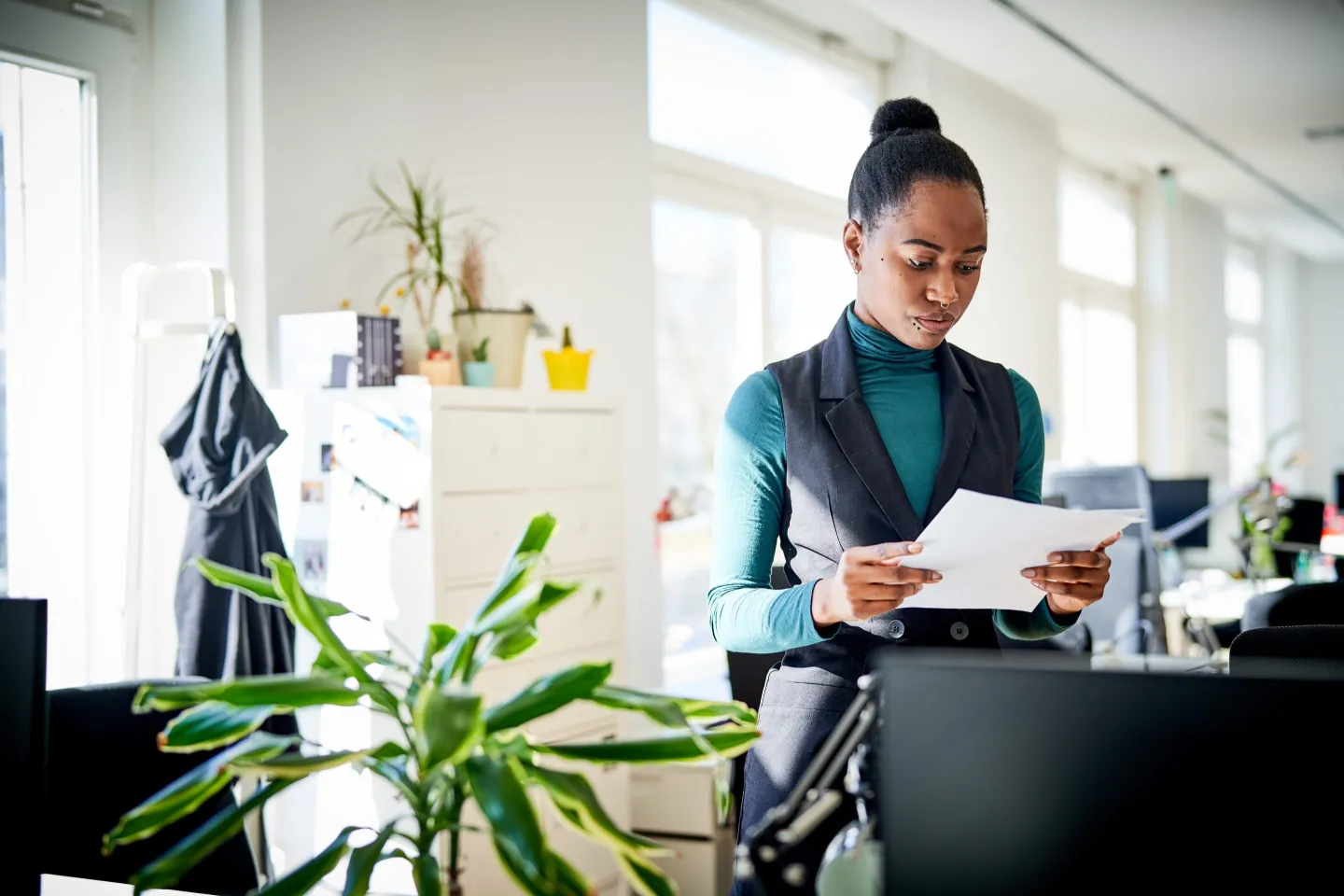 Businesswoman at office going through paperwork