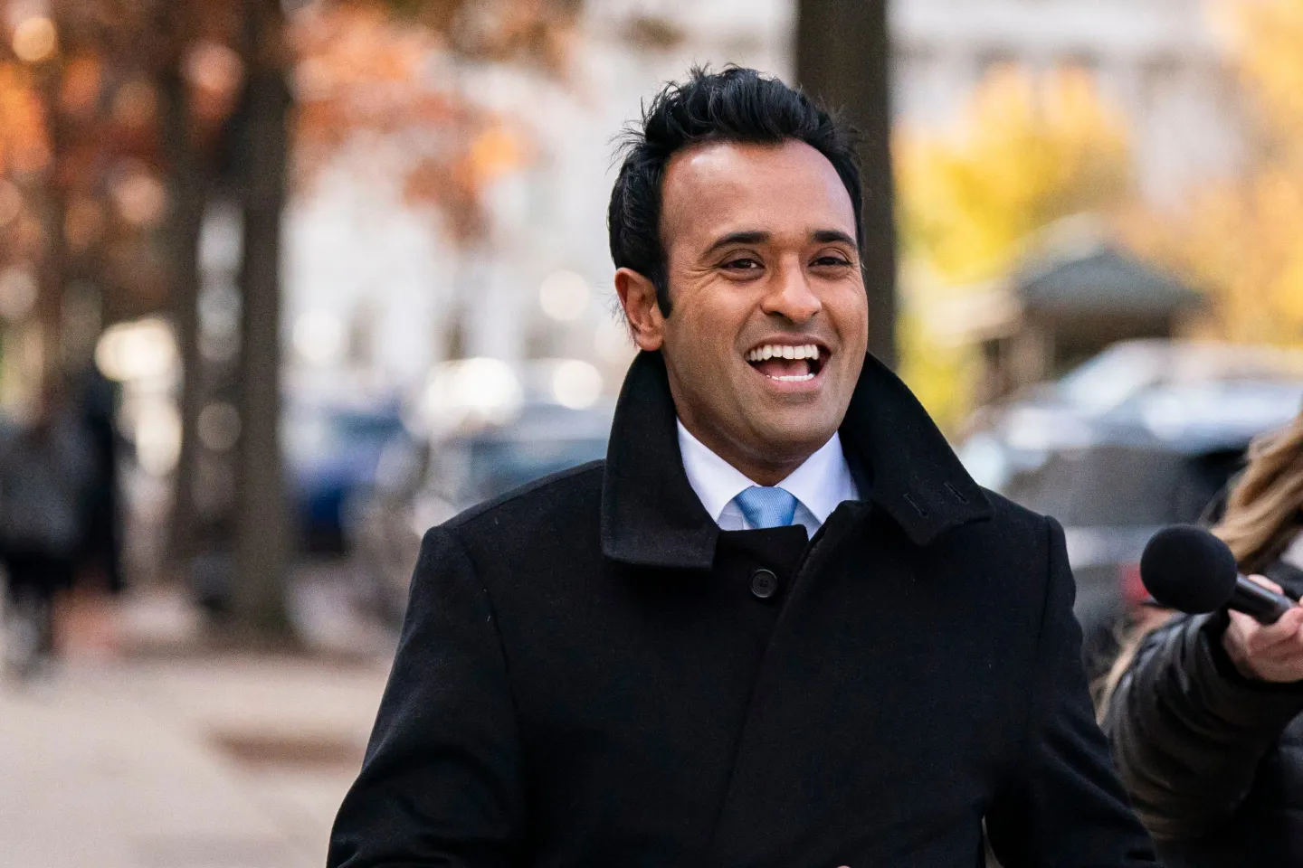 Vivek Ramaswamy outside in coat and tie