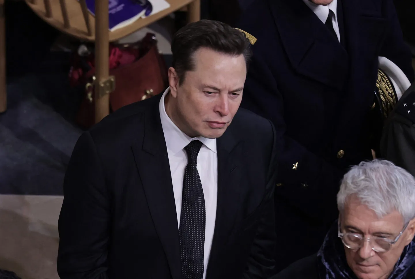 Tesla and SpaceX CEO Elon Musk (C) looks on inside Notre-Dame Cathedral during a ceremony to mark the re-opening of the landmark cathedral, in central, Paris on December 7, 2024.