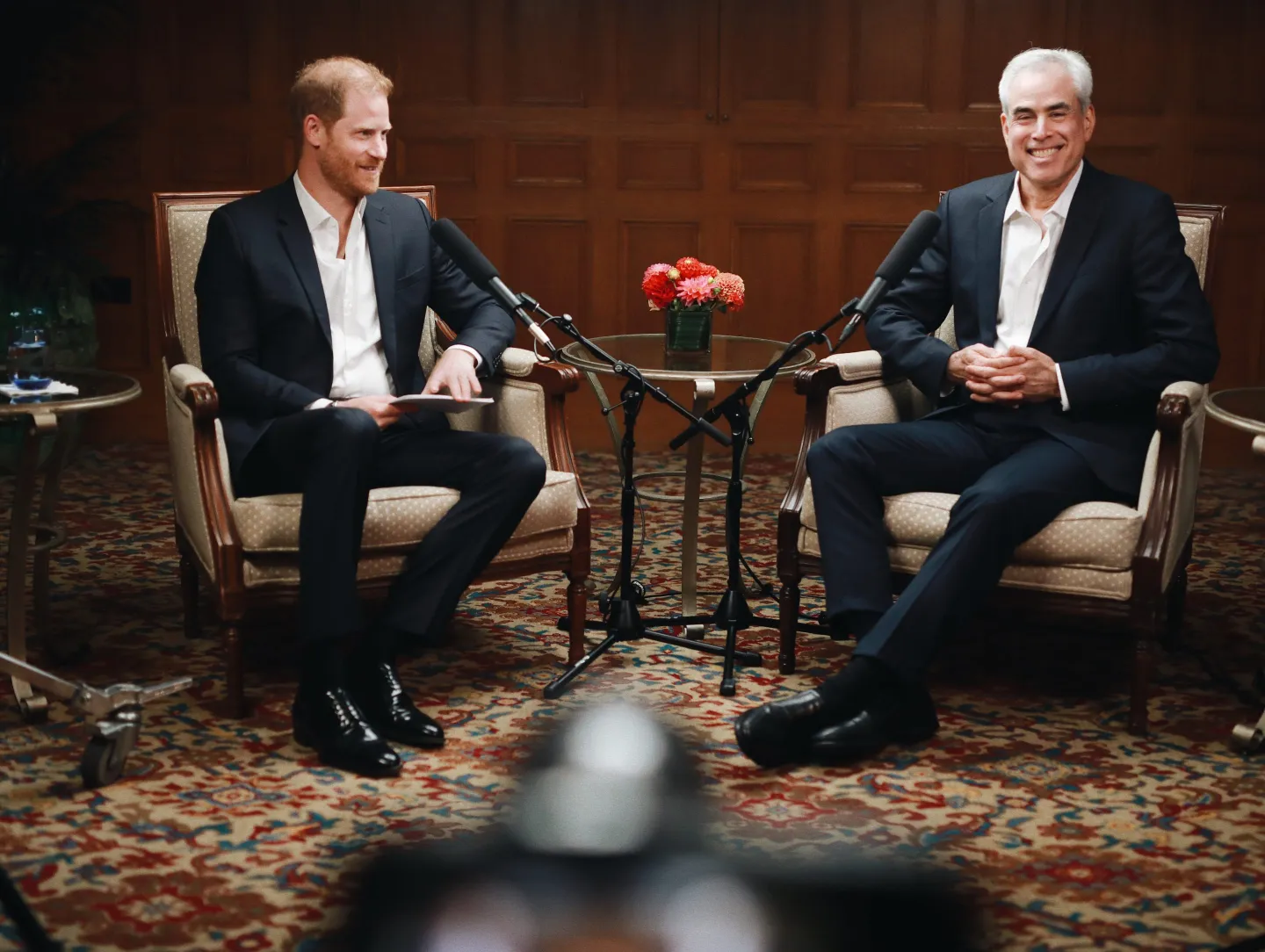 Prince Harry and Jonathan Haidt sitting in chairs facing each other