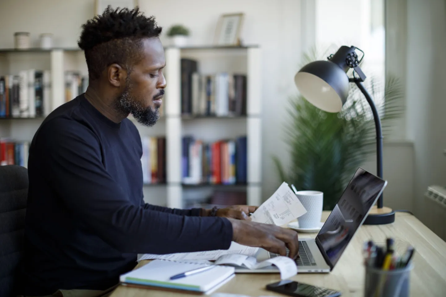 Man calculating budget and finances