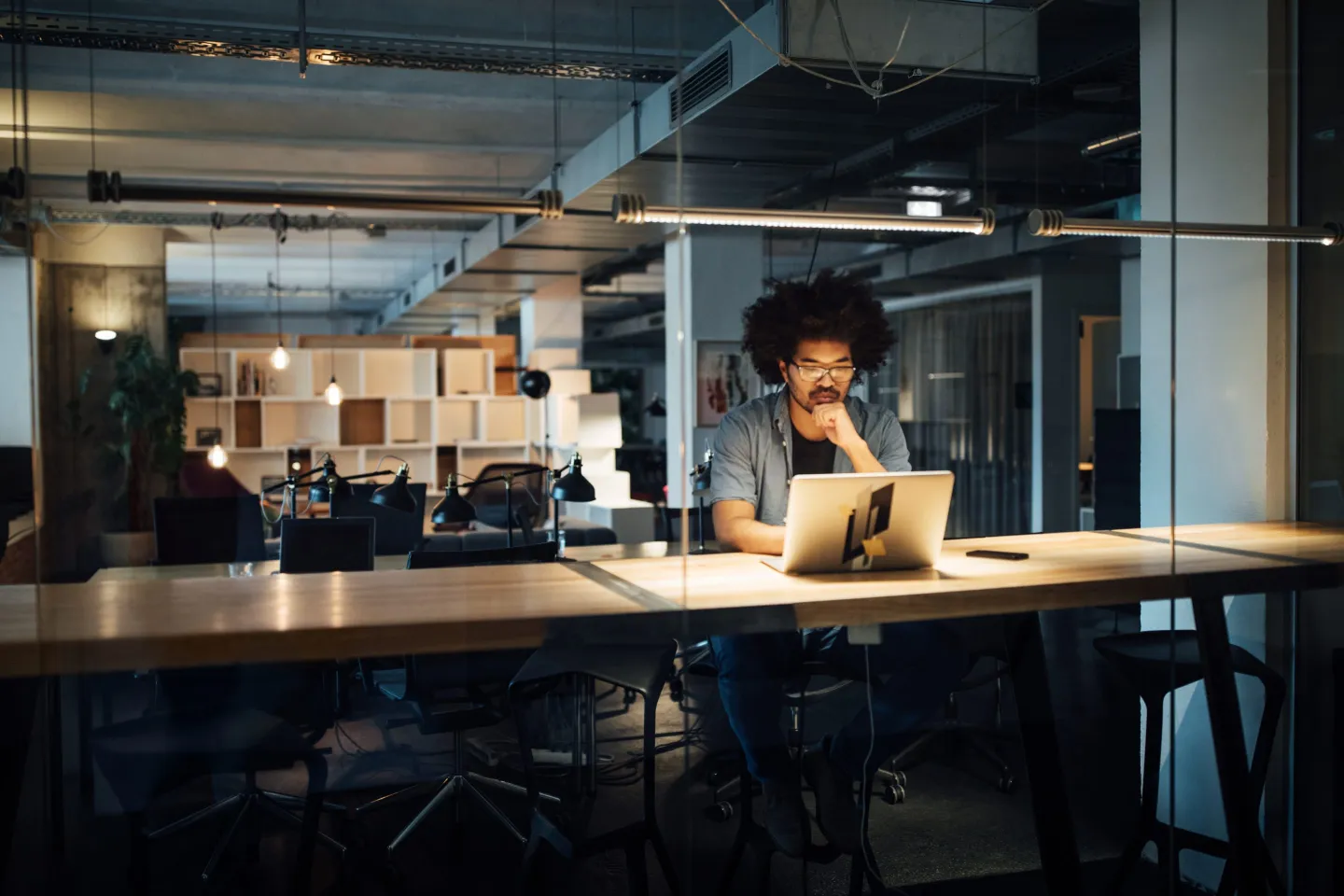 Serious businessman working on laptop