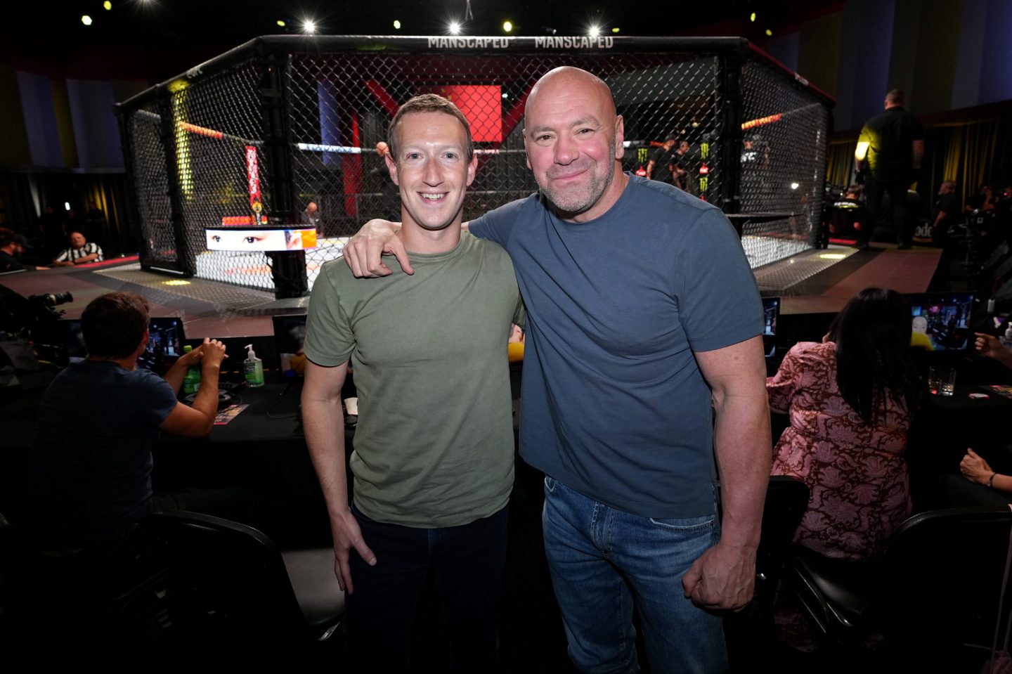 Mark Zuckerberg and Dana White pose for the camera arm-in-arm.